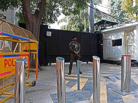 A security personnel stands guard at the main entrance of the residence of Delhi's Chief Minister Arvind Kejriwal in New Delhi on December 8, 2020.