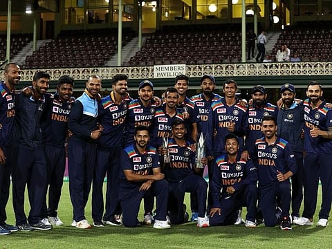 Members of Team India pose with the winners' trophies at the end of the Twenty20 International series in Sydney.