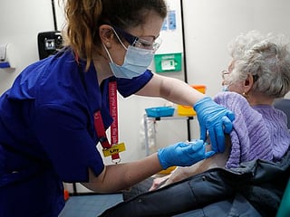 In Pictures: First COVID-19 vaccinations begin in UK