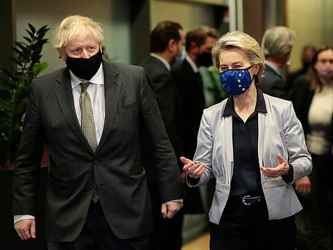 European Commission President Ursula von der Leyen, right, speaks with British Prime Minister Boris Johnson prior to a meeting at EU headquarters in Brussels, Wednesday, Dec. 9, 2020.