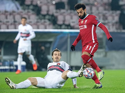 FC Midtjylland's Erik Sviatchenko in action with Liverpool's Mohamed Salah.