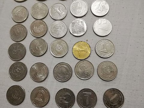 Some of the 39 varieties of Dh1 coins collected by Shaijal Kelettil.