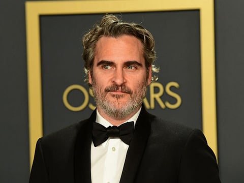 In this file photo taken on February 9, 2020 US actor Joaquin Phoenix poses in the press room with the Oscar for Best Actor for "Joker" during the 92nd Oscars at the Dolby Theater in Hollywood, California.