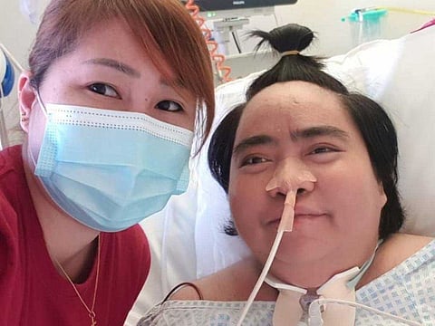 Theresa Acosta with her friend Aiza Andres at the Burjeel Hospital, Abu Dhabi.
