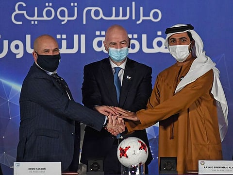 Sheikh Rashid bin Humaid Al Nuaimi, President of the UAE Football Association (right), FIFA President Gianni Infantino (centre), and Oren Hasson, President of the Israeli Football Association.