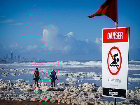 Tourists walk amongst beach foam in the wake of cyclonic conditions at Currumbin Beach in Australia. (File photo for illustrative purposes only)