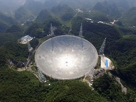 This handout photograph taken on August 24, 2016 and released on December 13, 2020 by the National Astronomical Observatories of the Chinese Academy of Sciences (NAOC) shows the five-hundred-metre Aperture Spherical radio Telescope (FAST) in Pingtang county, in southwestern China's Guizhou province.