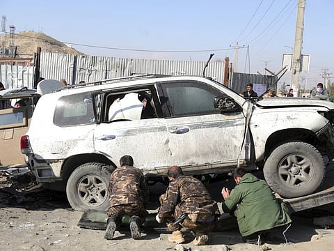 Afghan security personnel arrive at the site of a bomb attack in Kabul, Afghanistan, Tuesday, December 15, 2020. A bombing and a shooting attack on Tuesday in the Afghan capital of Kabul killed a few people, including a deputy provincial governor, officials said.(AP Photo/Rahmat Gul)