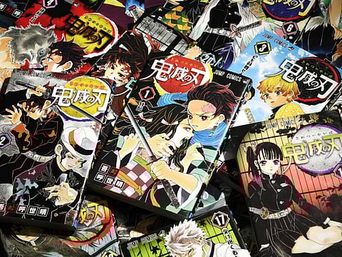 Comic books of the popular Japanese manga "Demon Slayer" (Kimetsu no Yaiba) by Koyoharu Gotouge are seen in this photo taken by Kyodo November 27, 2020. Picture taken on November 27, 2020. Mandatory credit Kyodo/via REUTERS ATTENTION EDITORS - THIS IMAGE WAS PROVIDED BY A THIRD PARTY. MANDATORY CREDIT. JAPAN OUT. NO COMMERCIAL OR EDITORIAL SALES IN JAPAN.