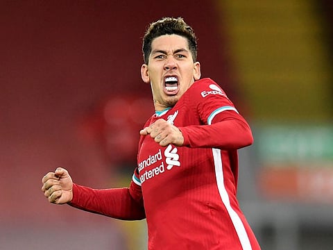 Liverpool's Roberto Firmino celebrates scoring their second goal.