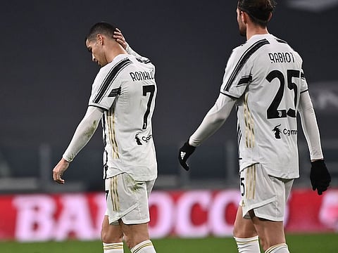 Cristiano Ronaldo (L) reacts at the end of Juventus vs Atalanta on December 16, 2020.