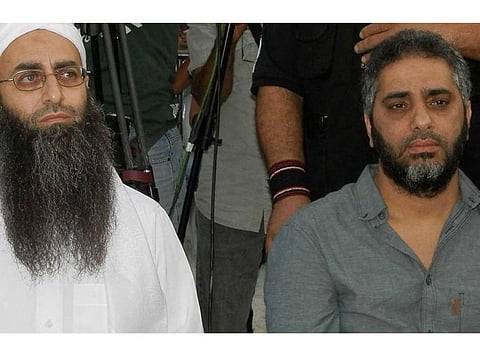 Lebanese singer Fadel Chaker (right) appears sporting a beard along with Islamist Ahmed Al Assir.
