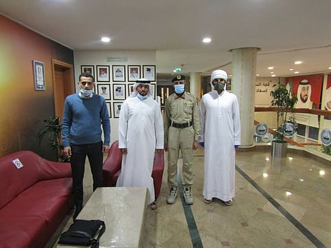 Al Kaabi with Dubai Police officers.