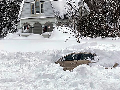 This photo, provided by the New York State Police, shows a car, in Owego, NY, from which a New York State Police sergeant rescued Kevin Kresen, stranded for 10 hours, covered by nearly 4 feet of snow thrown by a plow during this week's storm.