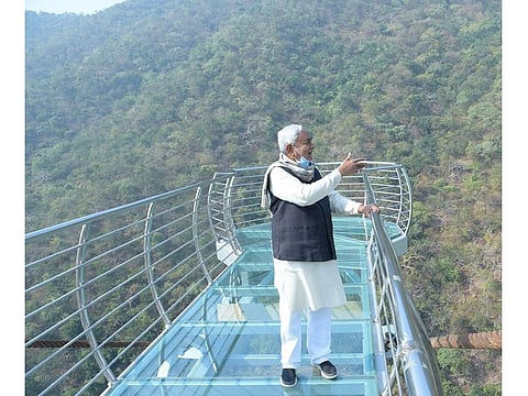 Chief Minister Nitish Kumar inspects the transparent glass sky bridge at Rajgir town, Bihar.
