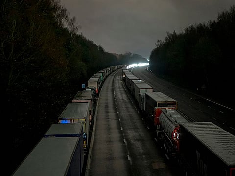 Lorries are backed up along the M20 motorway in England after the port at Dover closed on Monday, Dec. 21, 2020.