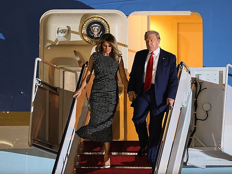 U.S. President Donald Trump and First Lady Melania Trump exit from Air Force One at the Palm Beach International Airport on December 23, 2020 in West Palm Beach, Florida.