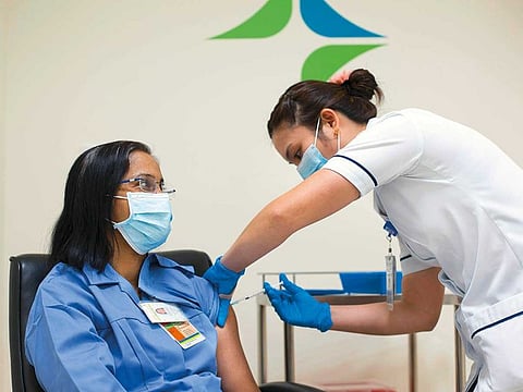 A shot of vaccine being delivered.