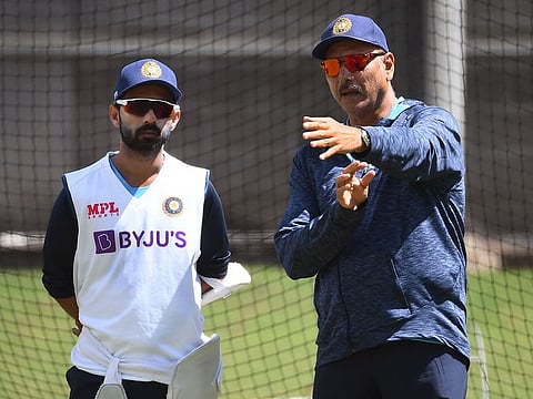Ajinkya Rahane speaks to India head coach Ravi Shastri during training in Melbourne