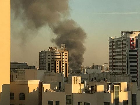 A fire in Sharjah industrial area could be seen from a distance.