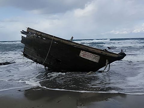 Part of a wooden boat containing human remains and suspected to be from North Korea, according to a Coast Guard official, is seen along a shore of Sado island, Niigata Prefecture, Japan December 28, 2019.