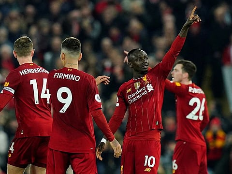 Sadio Mane salutes the crowd after his winner over Wolves.