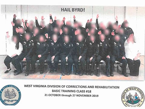 In this photo received by AFP on December 30, 20190 from the W.Va., the Division of Corrections and Rehabilitation, Basic Training Class #18 in West Virginia poses for a photo as they gesture.