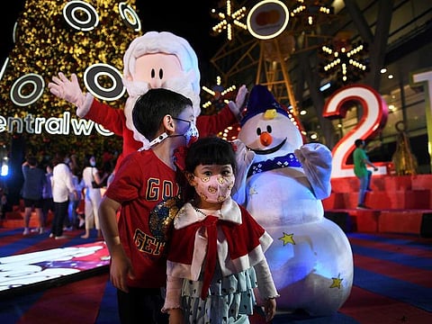 Children wearing face masks gather at a shopping mall as The New Year countdown celebrations and crowded events were banned amid the spread of the coronavirus disease (COVID-19) in Bangkok, Thailand, December 31, 2020.