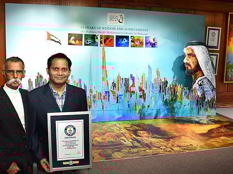Ramkumar Sarangapani (right), the Guinness World records holder for the Largest Pop Up Greetings Card with Akbar Saheb (left), the artist who designed the card.