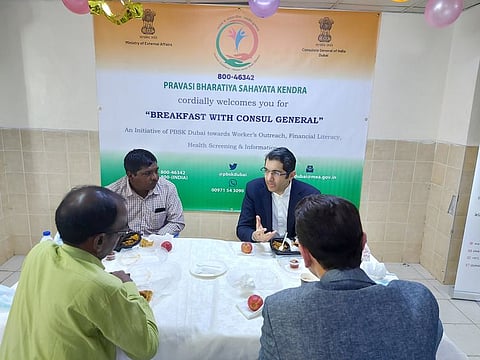 Consul General of India Dr Aman Puri joins workers for breakfast.