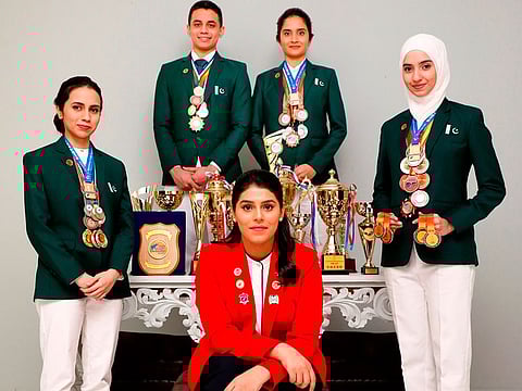 Team Pakistan with Emma Alam (right).