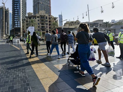 People at Downtown area in Dubai to witness fireworks in Burj Khalifa on New Years Eve.