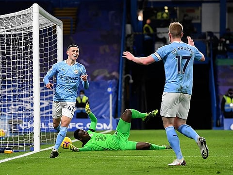 Phil Foden celebrates with Kevin De Bruyne after scoring Manchester City's second.