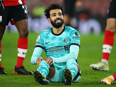 Mohamed Salah reacts after missing a chance.