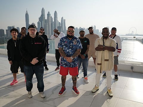 British DJ and radio host Charlie Sloth (centre) with Bigg Hass (left) and rappers who are participating in ‘Fire in the Booth: The Dubai Series’.