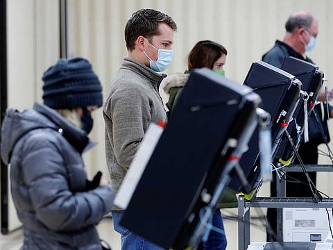 Voters cast their ballots in the US Senate run-off election, at a polling station in Marietta, Georgia, US, January 5, 2021.