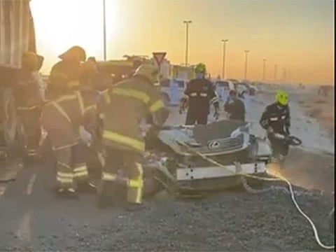 Fujairah Police rescue officials using hydraulic cutters to recover the body of the man from a crushed car on Wednesday. Screen grab