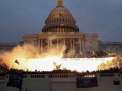 File photo: An explosion caused by a police munition is seen while supporters of US President Donald Trump gather in front of the US Capitol Building in Washington.