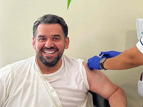 Hussain Al Jassmi, popular Emirati musician, receiving COVID-19 vaccine