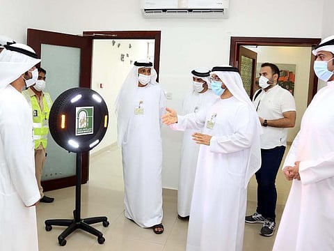 Sharjah Municipality officials at the launch of the environmentally friendly illuminated warning signs.