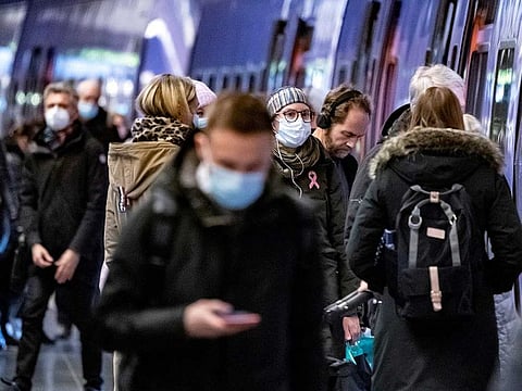 Passengers wearing protective masks walk on a platform at Malmo Central Station amid the coronavirus disease (COVID-19) outbreak in Malmo, Sweden January 7, 2021.