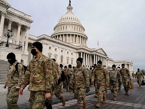 Members of the National Guard arrive to the US Capitol days after supporters of US President Donald Trump stormed the Capitol in Washington, US, January 11, 2021.