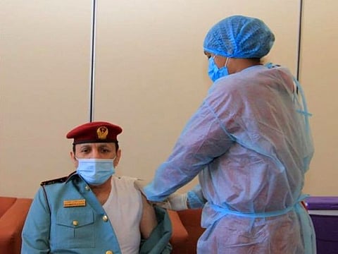 Major General Mohammad Ahmad bin Ghanim Al Kaabi, commander-in-chief of Fujairah Police receives the first dose of the new vaccine against Covid-19 coronavirus.