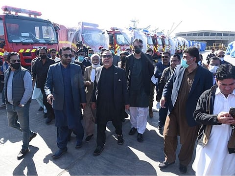 Sindh Governor Imran Ismail along with Federal Planning and Development Minister Asad Umar inspect the 50 newly arrived fire engines at Karachi Port.