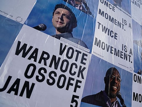 Campaign ads for Jon Ossoff and Raphael Warnock are seen on a wall near the John Lewis mural the day after the U.S. Senate runoff elections in Atlanta, Georgia, U.S., January 6, 2021.