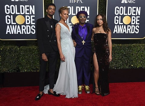 Director Spike Lee, second right, and his family, from left, son Jackson Lee, wife Tonya Lewis Lee and daughter Satchel Lee, right, arrive at the 76th annual Golden Globe Awards in Beverly Hills, Calif. on Jan. 6, 2019.