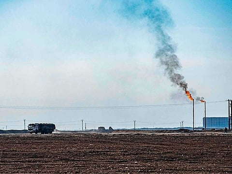 A tank truck advances on a road at the Rumaylan (Rmeilan) oil fields in Syria's Kurdish-controlled northeastern Hasakeh province, on January 6, 2021, transporting the valuable resource to government-controlled areas.