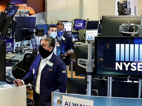 Stocks on Wall Street shuffled to a meek end to the week, after choppy trading marked by a shock collapse in consumer confidence.