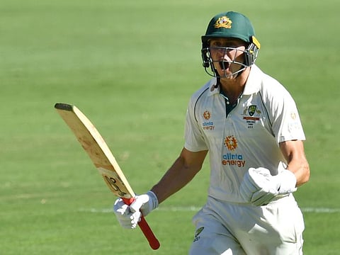 Marnus Labuschagne of Australia celebrates scoring a century on first day of the fourth Test against India at the Gabba in Brisbane on Friday.