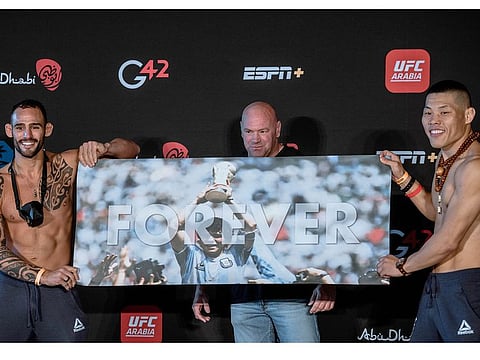 Santiago Ponzinibbio, left, with his Maradona poster
